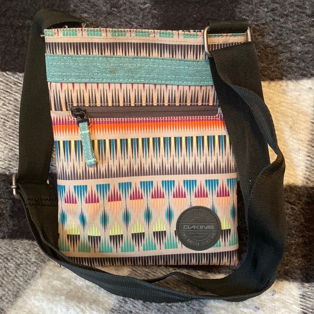 Dakine shoulder bag, extra long adjustable nylon strap. 9.5” deep, 7.5” wide